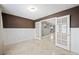 Stylish office space with wainscoting, travertine floors, and glass French doors leading to the rest of the house at 11618 Costa Linda Ave, Las Vegas, NV 89138