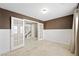 Stylish office space with wainscoting, travertine floors, and glass French doors leading to the rest of the house at 11618 Costa Linda Ave, Las Vegas, NV 89138