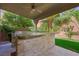 Outdoor kitchen featuring built in grill and stone counter, perfect for entertaining at 11618 Costa Linda Ave, Las Vegas, NV 89138