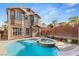 Backyard featuring pool, hot tub, and covered outdoor living area, perfect for entertaining guests at 11784 Golden Moments Ave, Las Vegas, NV 89138