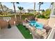 Private backyard featuring a pool, hot tub, and basketball court, all enclosed by a brick wall at 11784 Golden Moments Ave, Las Vegas, NV 89138