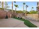 Inviting backyard with pool, hot tub, basketball court, and lush landscaping for outdoor enjoyment at 11784 Golden Moments Ave, Las Vegas, NV 89138
