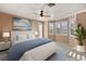 Light and bright primary bedroom suite with large windows and neutral decor at 11784 Golden Moments Ave, Las Vegas, NV 89138