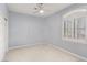 Comfortable carpeted bedroom with a built-in window shutter and ample closet space at 11784 Golden Moments Ave, Las Vegas, NV 89138