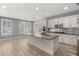 Contemporary kitchen with stainless steel appliances, large island, and ample cabinet space at 11784 Golden Moments Ave, Las Vegas, NV 89138