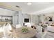 Open-concept living and dining area with modern decor and abundant natural light at 11784 Golden Moments Ave, Las Vegas, NV 89138