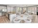 Stylish, open-concept living space with modern kitchen, dining area, and comfortable seating at 11784 Golden Moments Ave, Las Vegas, NV 89138