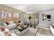 Bright living room with hardwood floors and modern furniture; a perfect space for relaxation at 11784 Golden Moments Ave, Las Vegas, NV 89138