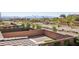 View of backyard with brick walls, showcasing potential for outdoor living and landscaping in a desert community at 12053 Arrebol Ave, Las Vegas, NV 89138