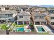 Aerial view of a backyard featuring a pool, spa, patio, and turf area, perfect for outdoor entertaining at 12053 Arrebol Ave, Las Vegas, NV 89138