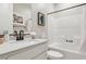Clean bathroom featuring white tile and tub at 12053 Arrebol Ave, Las Vegas, NV 89138