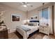 Cozy bedroom with a plush bed, decorative pillows, bedside tables, and elegant lighting at 12053 Arrebol Ave, Las Vegas, NV 89138