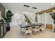 Elegant dining area with modern lighting and staircase, perfect for formal entertaining at 12053 Arrebol Ave, Las Vegas, NV 89138