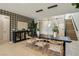 Chic dining area with modern light fixture adjacent to the staircase at 12053 Arrebol Ave, Las Vegas, NV 89138