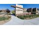 Elegant community entrance featuring stone signage and landscaping, creating a welcoming atmosphere at Castellana at 12053 Arrebol Ave, Las Vegas, NV 89138