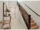 Inviting entryway with staircase and natural light at 12053 Arrebol Ave, Las Vegas, NV 89138
