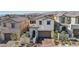 Charming two-story home with a well-manicured front yard, brick paved driveway, and inviting entrance at 12053 Arrebol Ave, Las Vegas, NV 89138