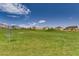 A verdant community park features green lawn space and views of the neighboring homes at 12053 Arrebol Ave, Las Vegas, NV 89138