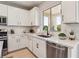The kitchen features stainless steel appliances and white countertops at 12053 Arrebol Ave, Las Vegas, NV 89138