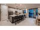 The kitchen features stainless steel appliances, an island and an eat-in kitchen at 12053 Arrebol Ave, Las Vegas, NV 89138