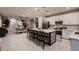 Bright, open kitchen featuring a large island with modern pendant lighting and stainless steel appliances at 12053 Arrebol Ave, Las Vegas, NV 89138