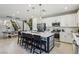 Well-appointed kitchen with a large island with counter seating at 12053 Arrebol Ave, Las Vegas, NV 89138