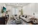 Inviting living room with comfortable seating, stylish decor, and ample natural light at 12053 Arrebol Ave, Las Vegas, NV 89138