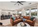 Inviting living room flows into an open kitchen with a view of the backyard pool at 12053 Arrebol Ave, Las Vegas, NV 89138