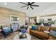 Open-concept living space features stylish furniture, modern decor, and a view of the kitchen at 12053 Arrebol Ave, Las Vegas, NV 89138