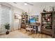 Well-lit office space with built-in shelving and a comfortable workspace at 12053 Arrebol Ave, Las Vegas, NV 89138