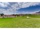 Expansive green community park with play areas and walking path, set against a mountain backdrop at 12053 Arrebol Ave, Las Vegas, NV 89138