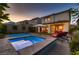 Beautiful backyard showcasing a pool, spa, lounge chairs, and a well-manicured landscape at 12053 Arrebol Ave, Las Vegas, NV 89138