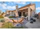 Outdoor living space with desert landscaping, ideal for lounging and enjoying the serene backyard ambiance at 12843 New Providence St, Las Vegas, NV 89141