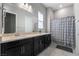 The bathroom boasts dual sinks, vanity, and a walk-in shower at 12843 New Providence St, Las Vegas, NV 89141