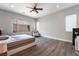 Spacious bedroom with a ceiling fan and natural light at 12843 New Providence St, Las Vegas, NV 89141