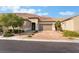 Charming single-story home with a well-manicured front yard and a brick driveway leading to a two-car garage at 12843 New Providence St, Las Vegas, NV 89141