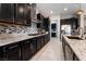 Well-equipped kitchen features granite countertops, stainless steel appliances, and mosaic tile backsplash at 12843 New Providence St, Las Vegas, NV 89141