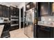 The kitchen offers granite countertops, stainless steel appliances, and custom cabinetry at 12843 New Providence St, Las Vegas, NV 89141