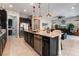 Open-concept kitchen features an island with granite counters and stainless steel appliances at 12843 New Providence St, Las Vegas, NV 89141