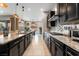Modern kitchen featuring granite countertops, stainless steel appliances, and custom cabinetry at 12843 New Providence St, Las Vegas, NV 89141