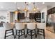 The kitchen features a large island with seating and granite counters at 12843 New Providence St, Las Vegas, NV 89141