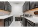 Efficient laundry room with sleek cabinetry, modern appliances, and ample storage for convenience at 12843 New Providence St, Las Vegas, NV 89141