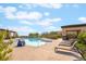 Resort-style pool area with comfortable lounge chairs and shade, ideal for leisure and recreation at 12843 New Providence St, Las Vegas, NV 89141