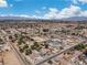 Sweeping aerial view of a residential neighborhood, showcasing houses with well-maintained yards and tree coverage at 131 Beesley Dr, Las Vegas, NV 89110