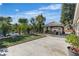 Backyard featuring stamped concrete, artificial turf, outdoor bar and mature landscaping at 131 Beesley Dr, Las Vegas, NV 89110
