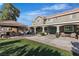 Expansive backyard features an outdoor bar, manicured landscaping, and a covered patio at 131 Beesley Dr, Las Vegas, NV 89110