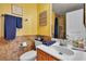 Charming bathroom with a decorative mirror, sink, towel rail, and a walk-in shower at 131 Beesley Dr, Las Vegas, NV 89110