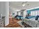 Large bedroom with vaulted ceilings, blue accent wall, shutters, and wood-look flooring at 131 Beesley Dr, Las Vegas, NV 89110
