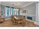 Elegant dining room with stylish chandelier, wood floors, and wainscoting at 131 Beesley Dr, Las Vegas, NV 89110