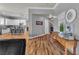 Welcoming entryway showcases hardwood floors, decorative wall art, and a glimpse of the adjacent kitchen at 131 Beesley Dr, Las Vegas, NV 89110